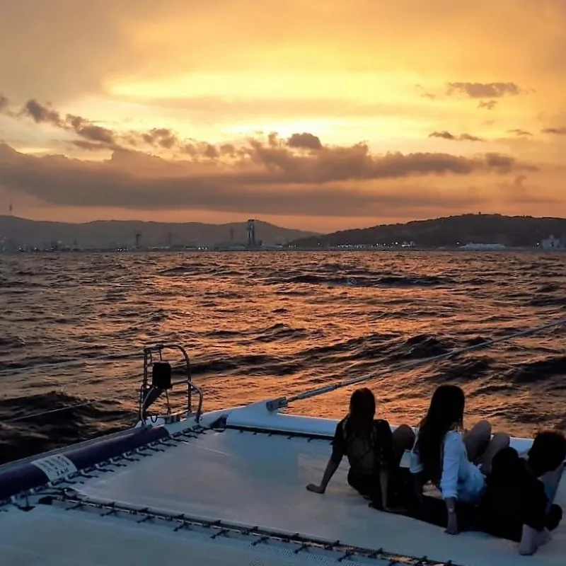 Enjoying sunset from Catamaran Orsom Barcelona
