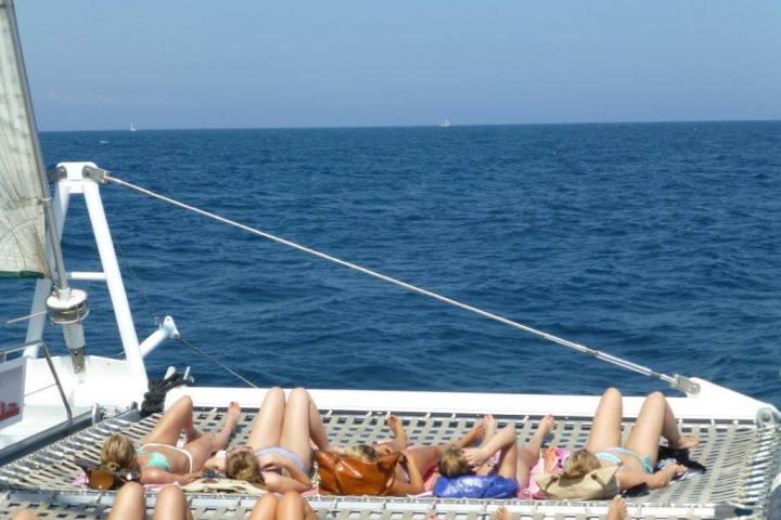 Sunbathing in Catamaran Orsom Barcelona