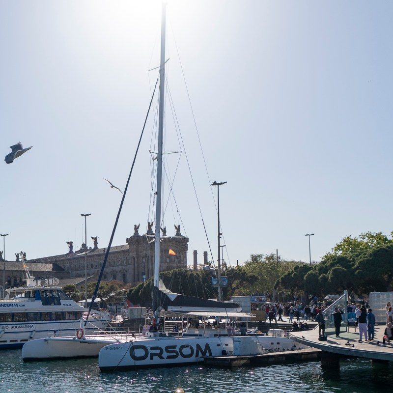 a boat is docked next to a body of water