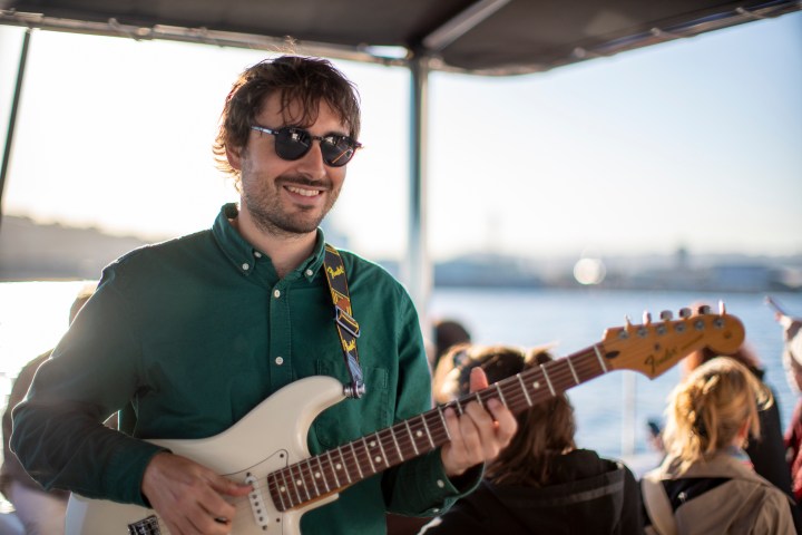 a man holding a guitar