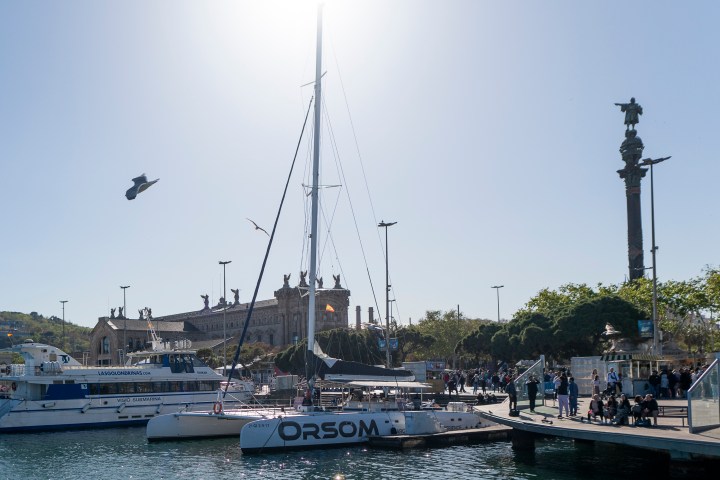 a boat is docked next to a body of water